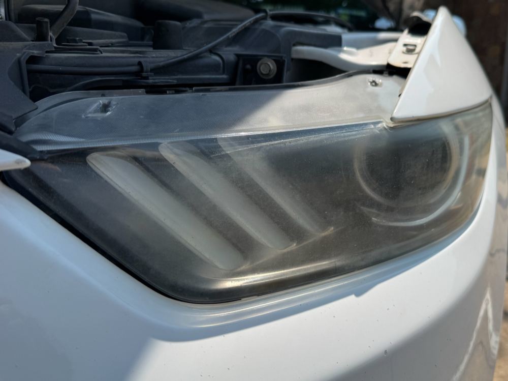 Ford Mustang headlight before restoration — Stay Bright OKC