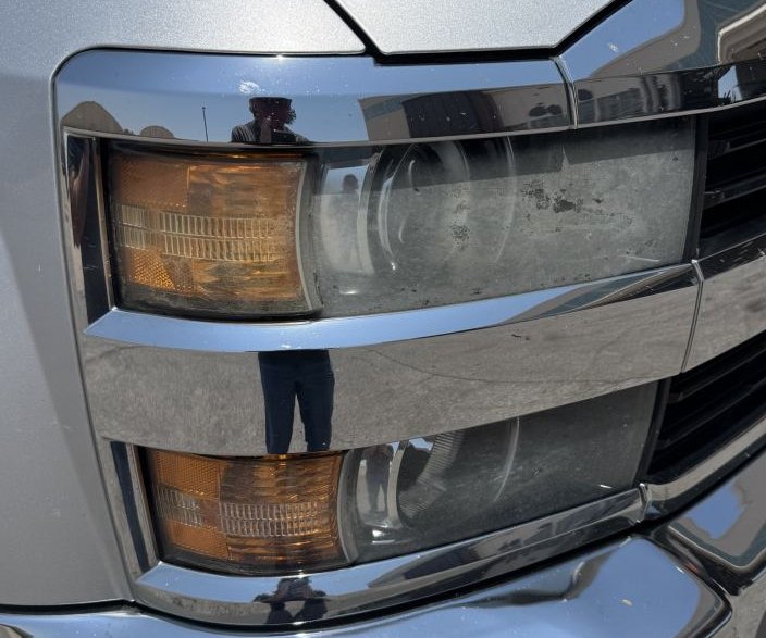 Chevrolet Silverado HD headlight before restoration — Stay Bright OKC